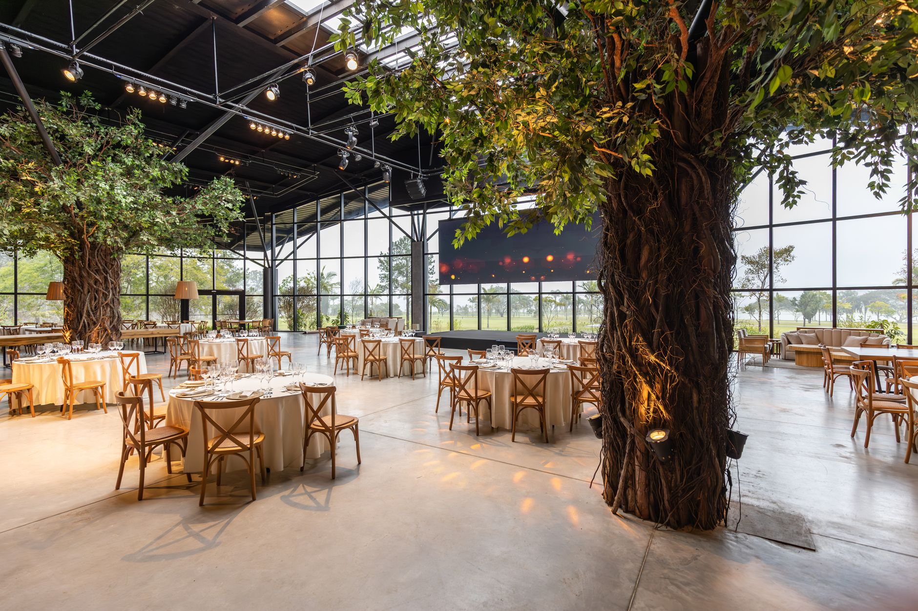 Restaurant dining area with indoor greenery